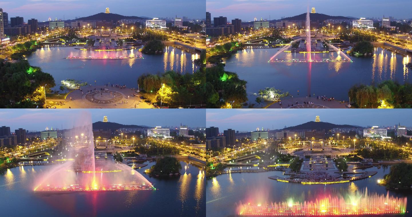 航拍枣庄薛城奚仲广场的夜景音乐喷泉