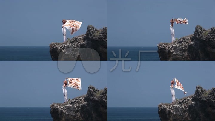 美女在海边吹海风