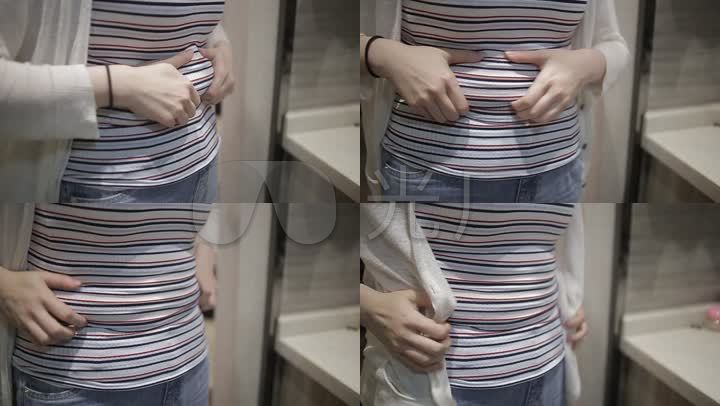年轻肥胖女人肚子上有赘肉