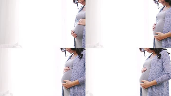 孕妇怀孕孕育准妈妈抚摸肚子