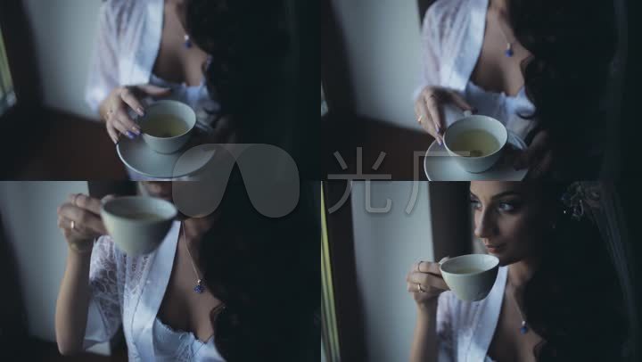 女子窗边喝茶逆光剪影