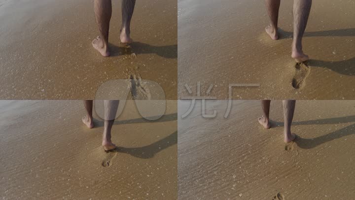 男人光着脚在沙滩上行走