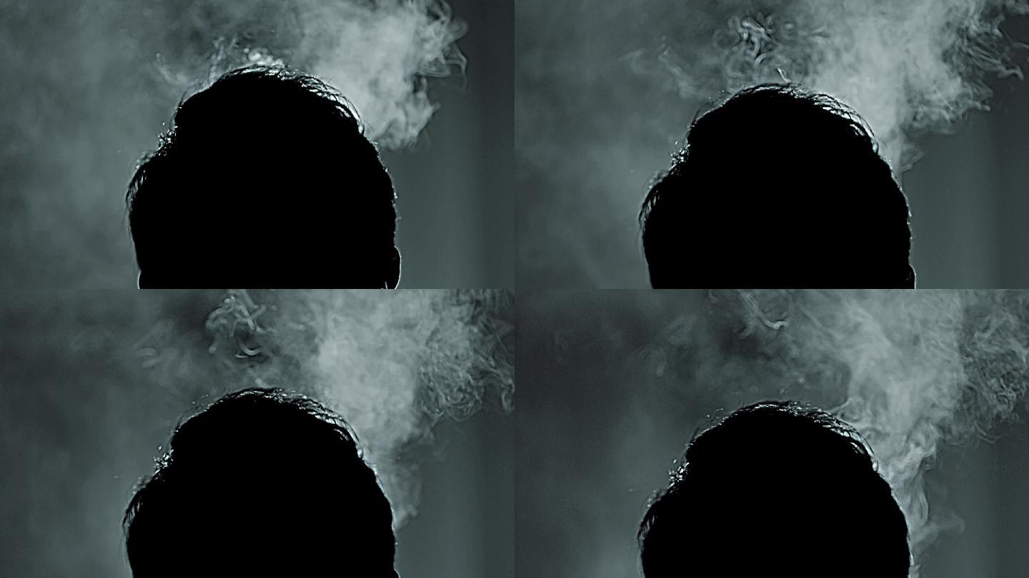 吸烟男人的背影特写吞云吐雾