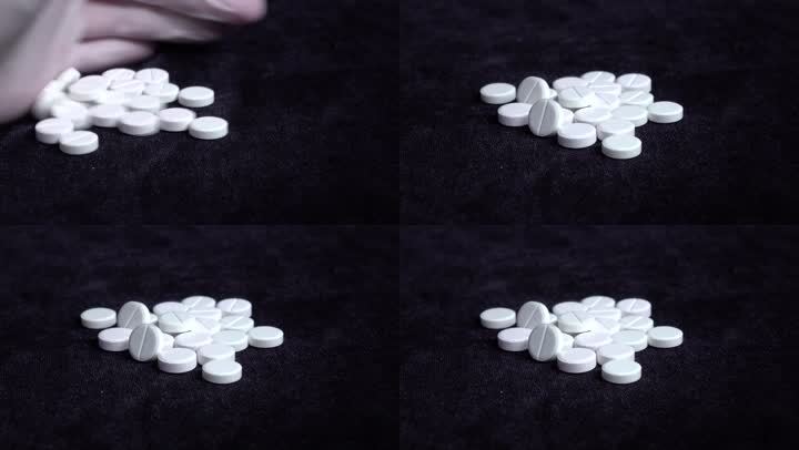 黑色背景下白色药片特写镜头