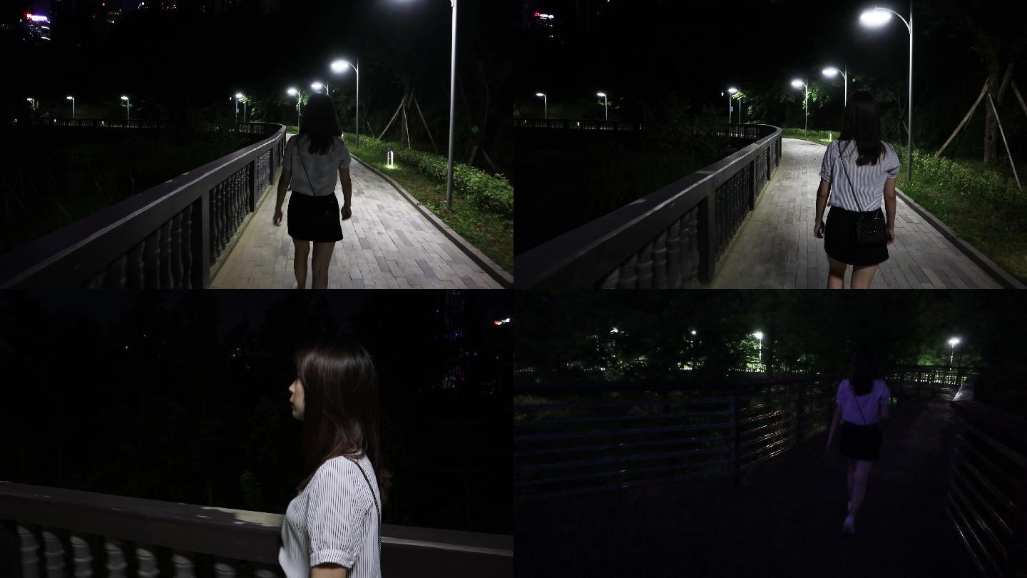 女生夜晚单独散步