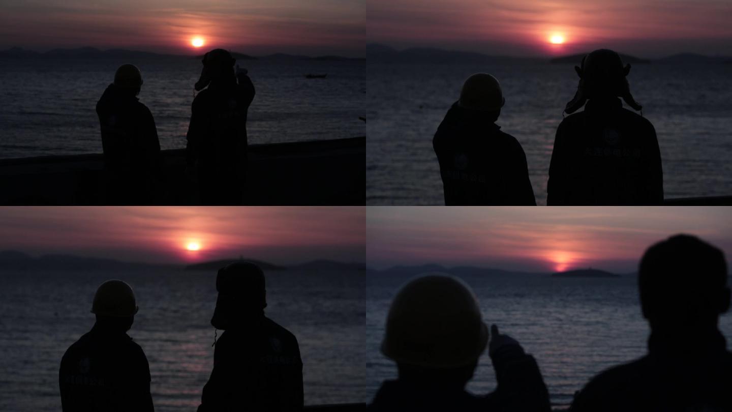 夕阳海边两个人的背影