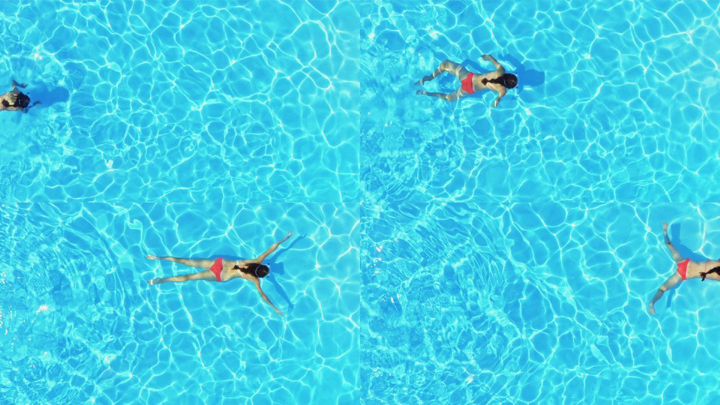 慢镜头中右上方是一个女孩在水下游泳的镜头.