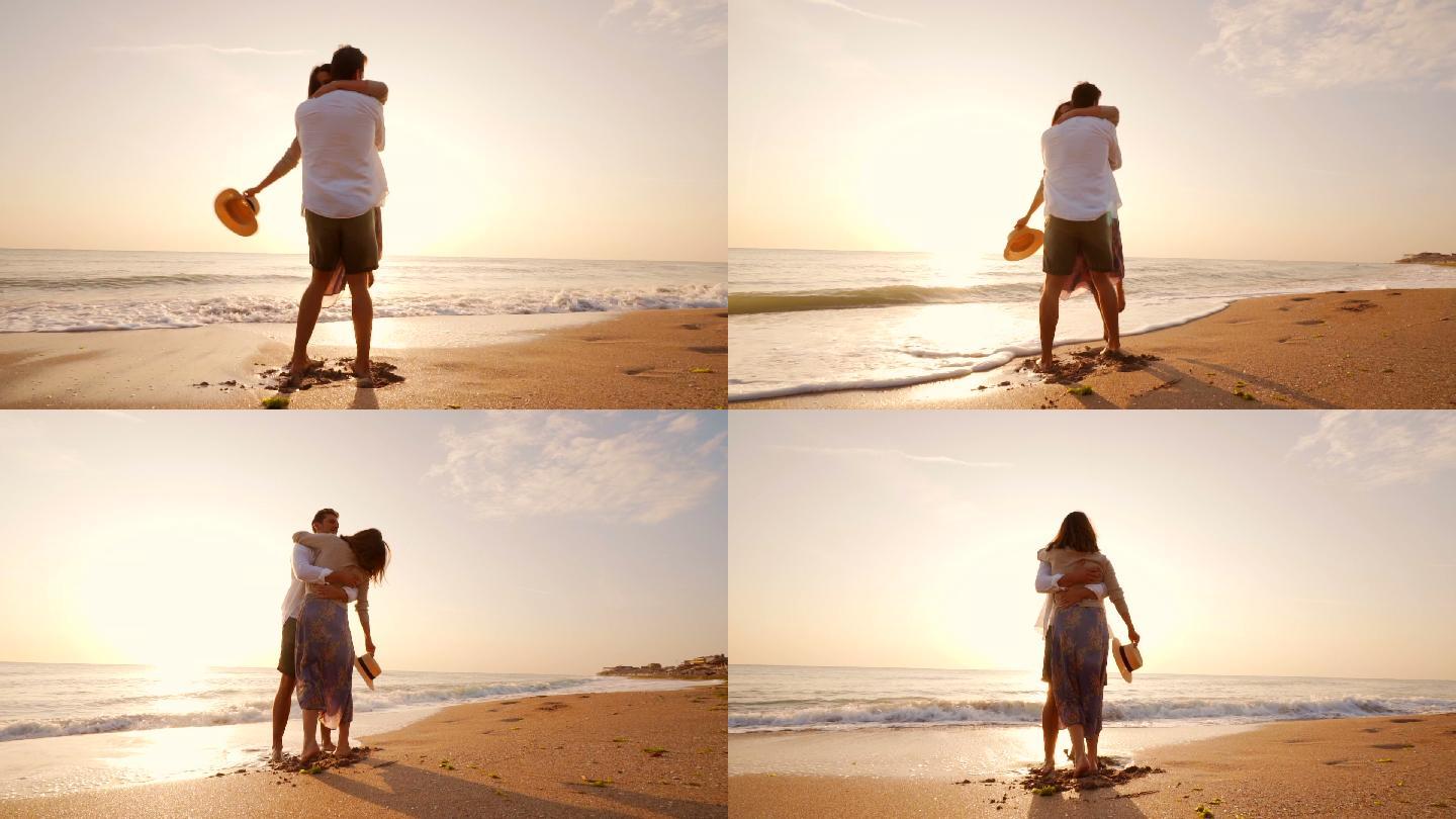 一对幸福的情侣在沙滩上拥抱