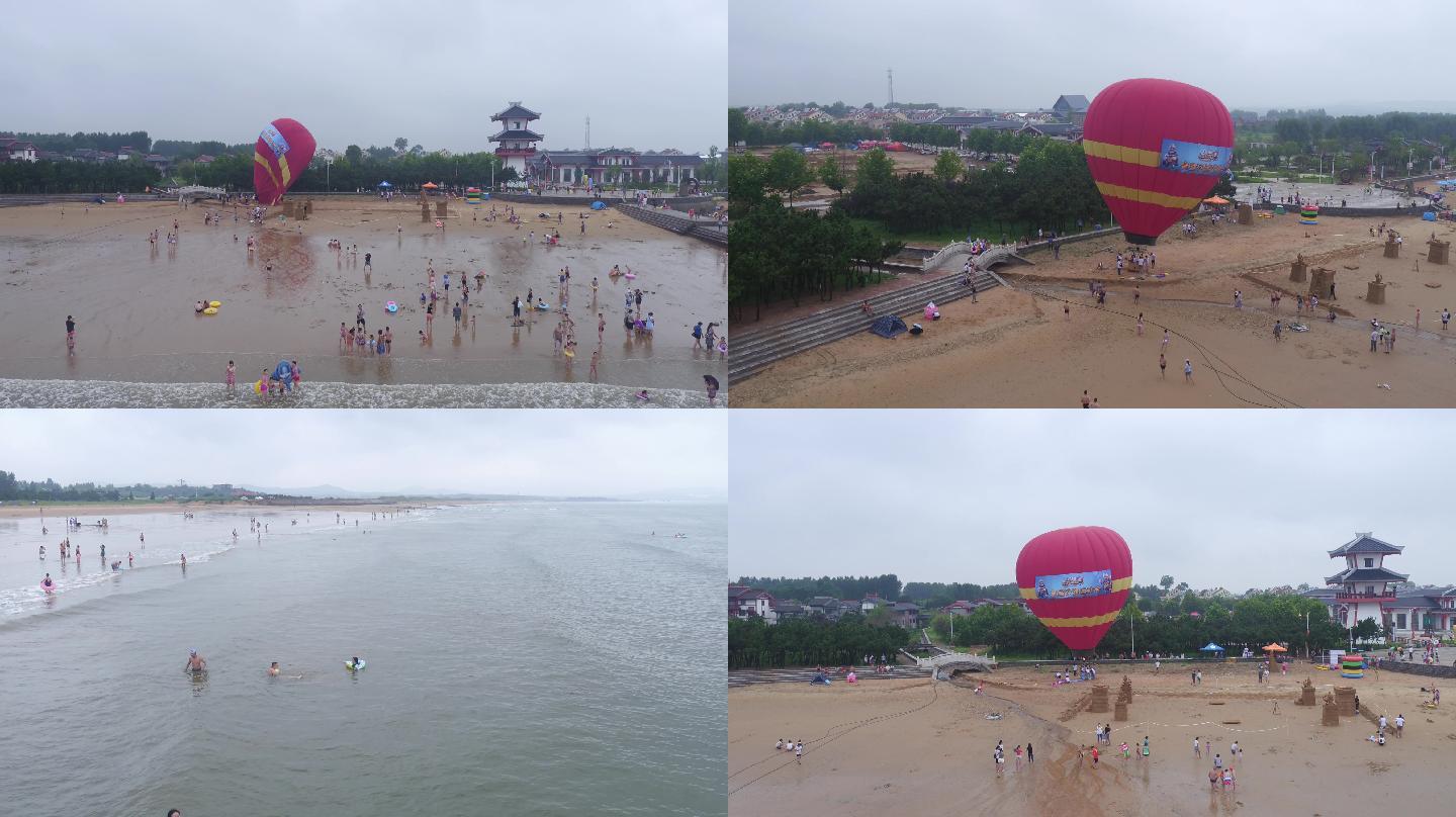 青岛海边航拍海滩人群游戏热气球