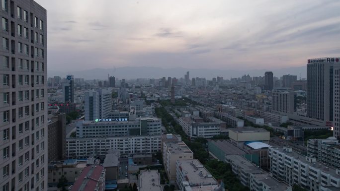 城市上空拍摄日落西山延时素材