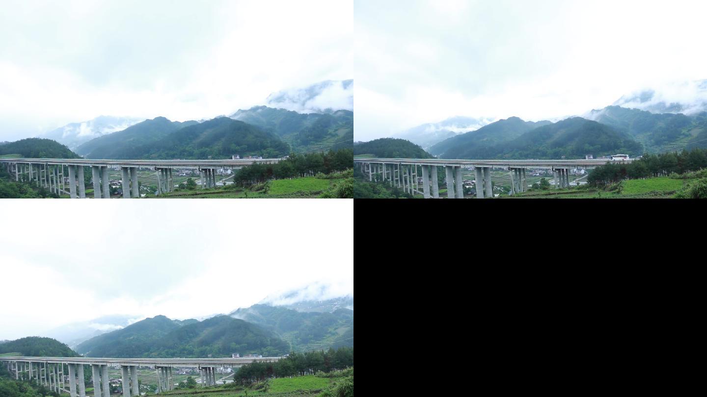 高速公路与大山村庄结合的云雾延时