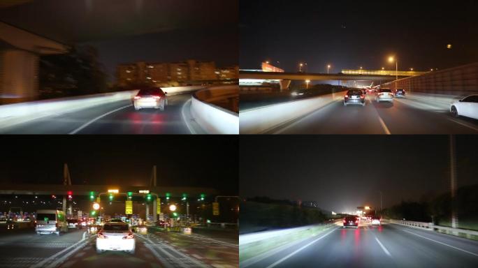 汽车在灯火通明的高速公路上行驶