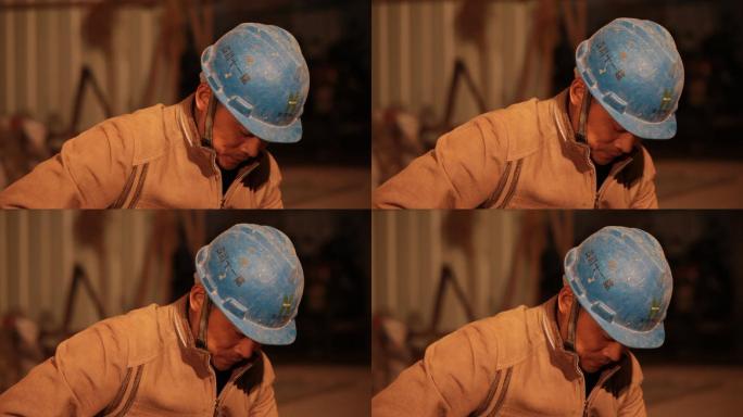 建筑工地工人头戴头盔特写