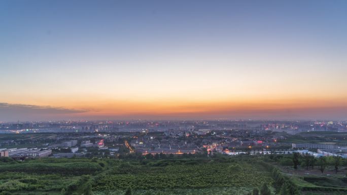 白鹿原上鸟瞰城市夕阳和夜晚