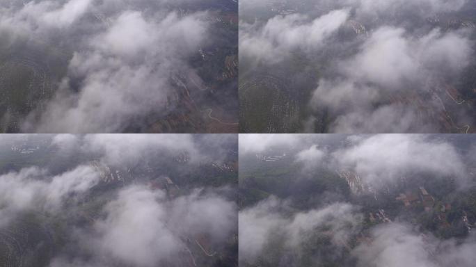 专业无人机航拍沂蒙山脉的云雾缭绕下的梯田