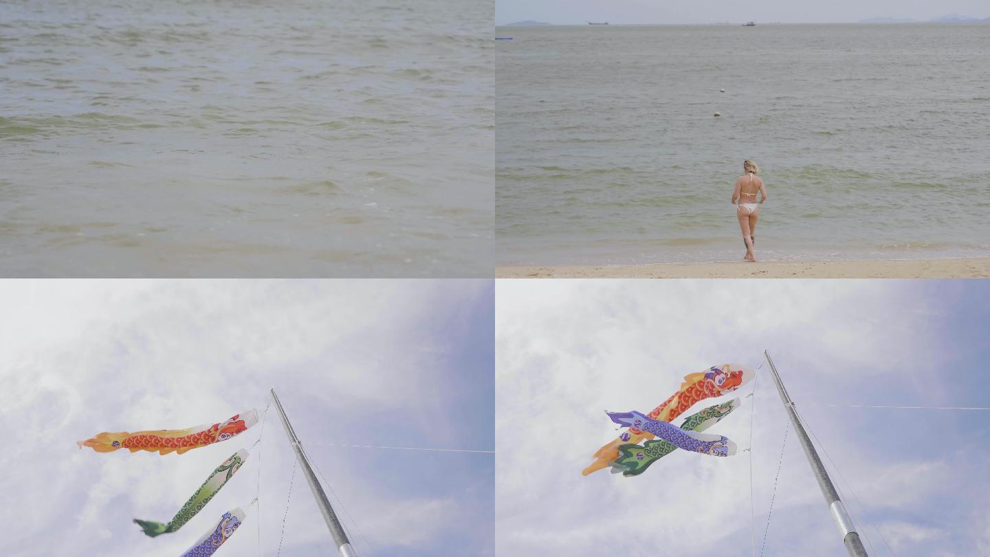惠州海滩海水波浪鲤鱼旗帜飘扬度假美女