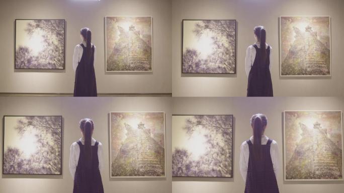 美女大学生参观画展背影