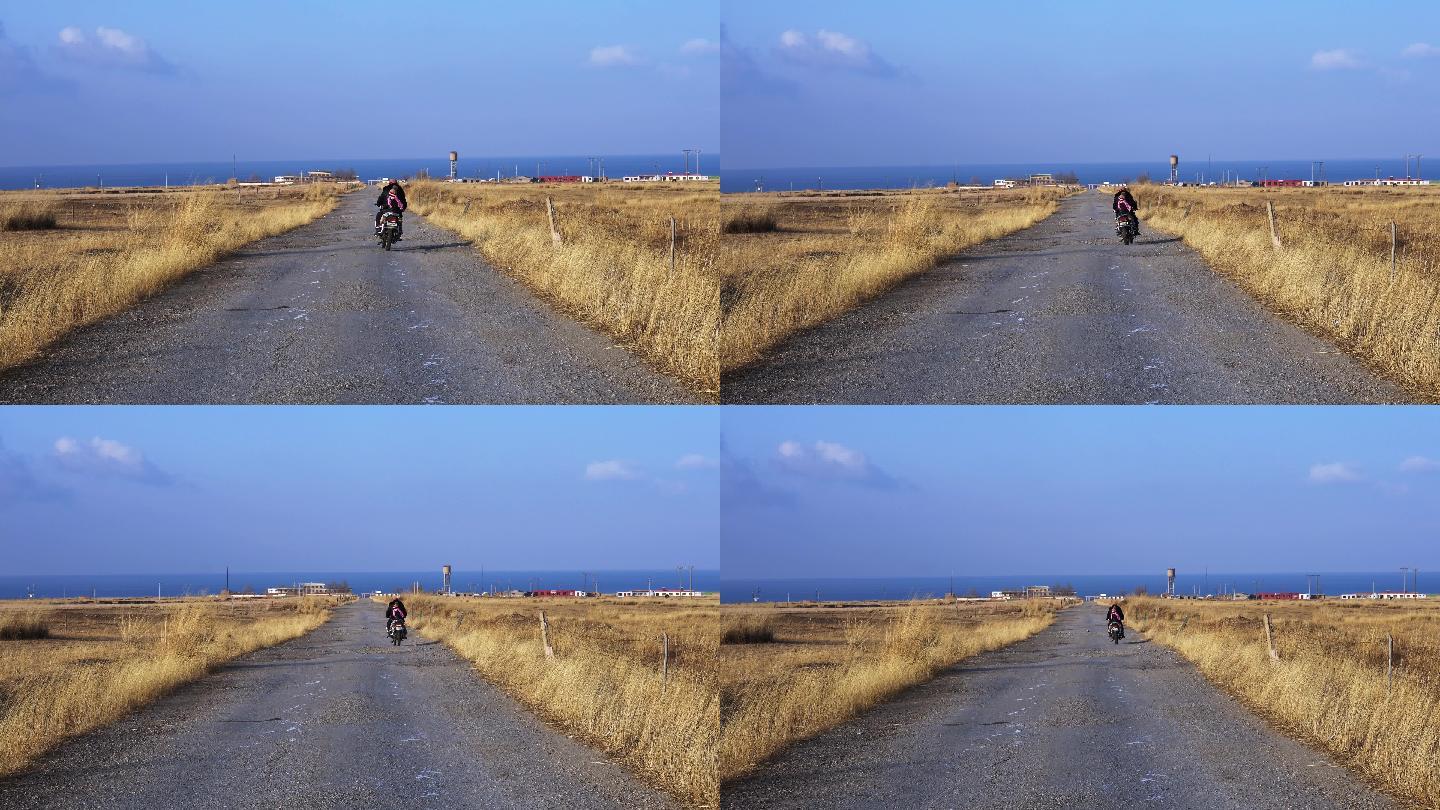 青海湖旁骑摩托车背影
