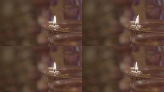 寺庙燃起的酥油灯灯油蜡烛特写镜头