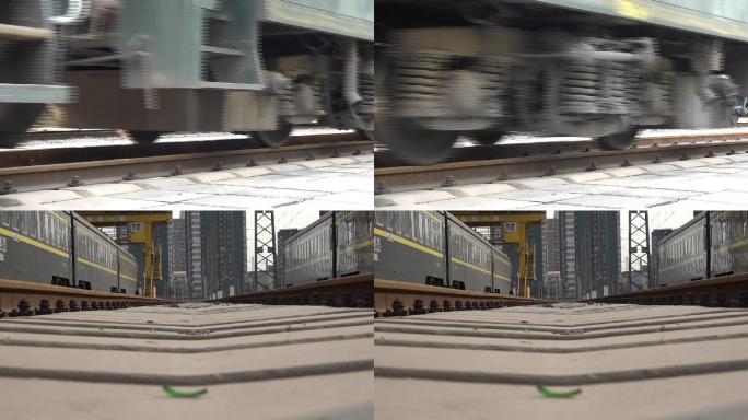 绿皮列车行驶中车轮铁轨