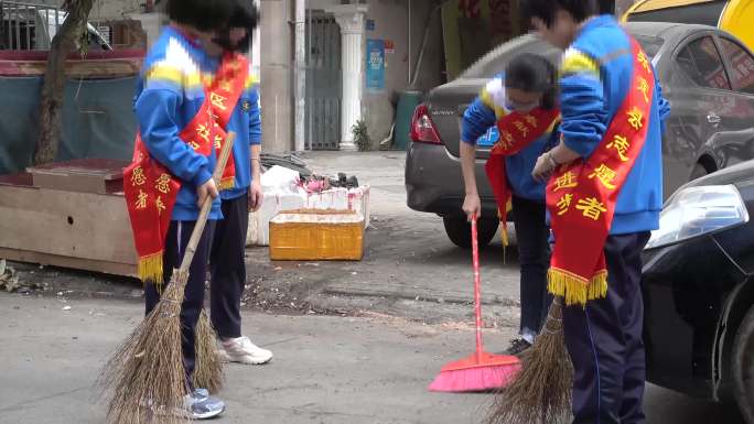 学生志愿者社区大扫除扫地卫生死角.