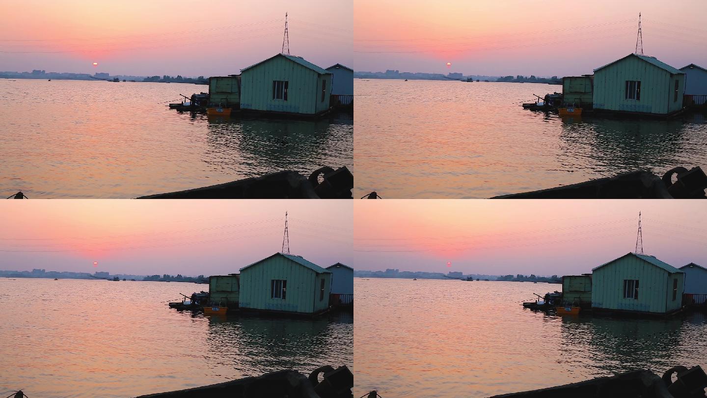 夕阳下河流上的船屋