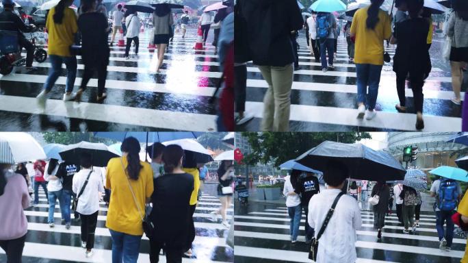羊城广州大雨，五一假期逛街的市民撑伞而行