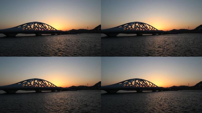 青岛西海岸新区珊瑚贝桥远景延时日落