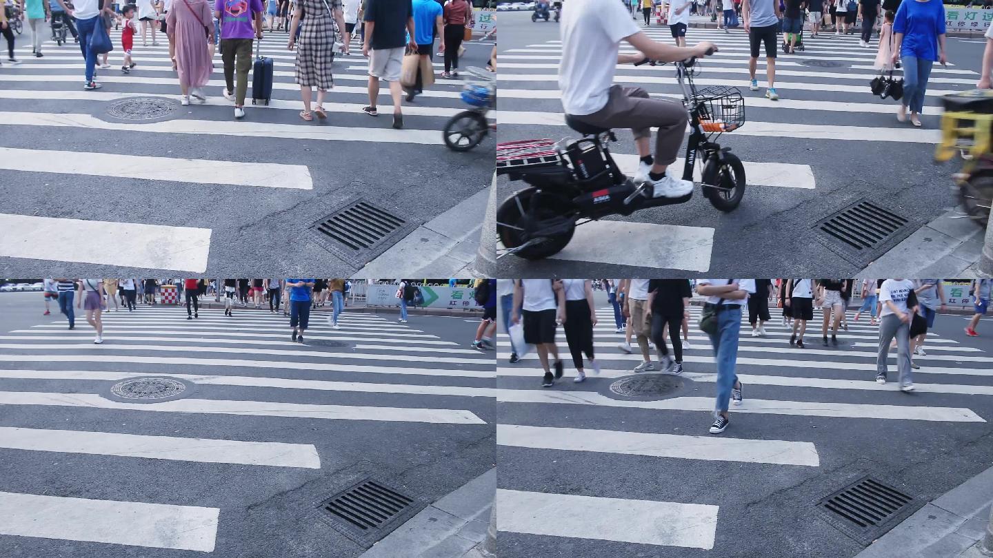 广州夏天周末的下午逛街的市民穿过马路