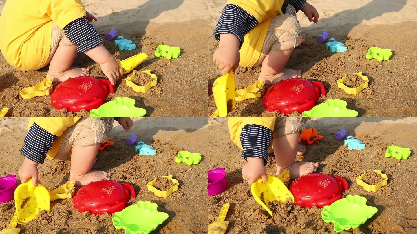 小孩子在沙滩玩沙子