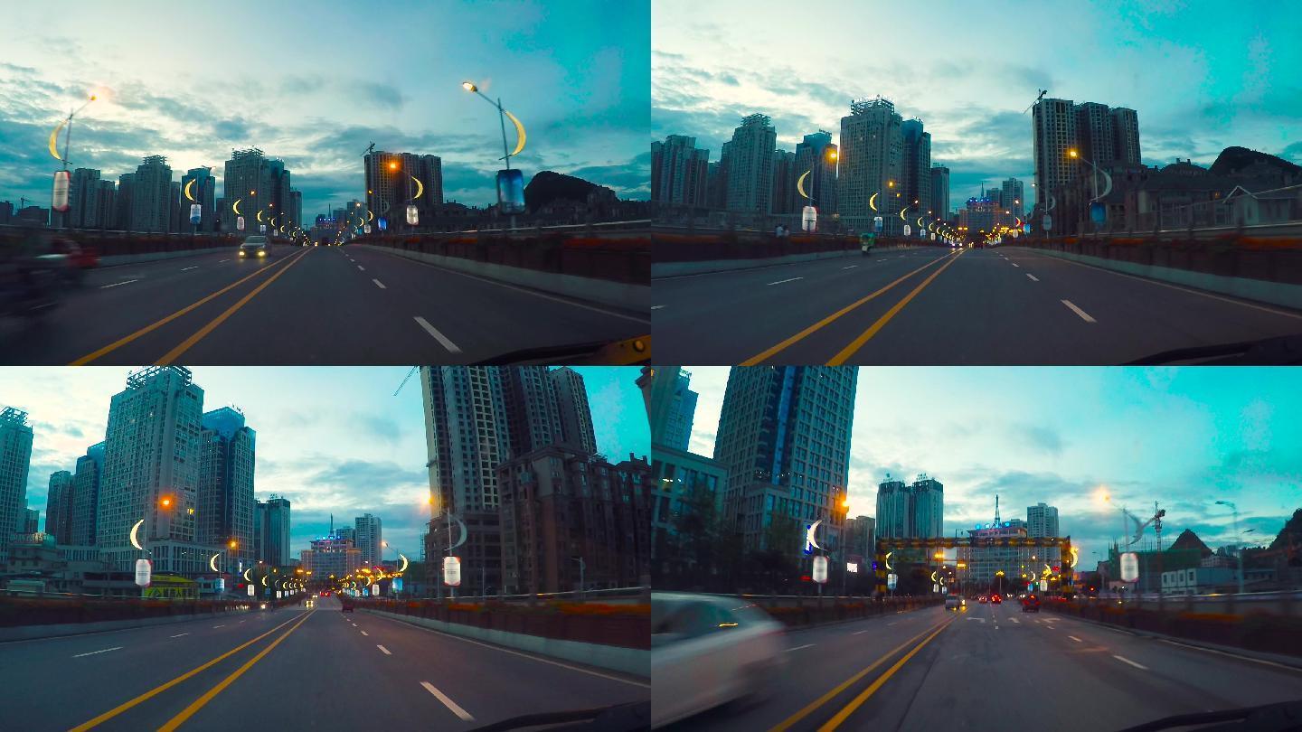 公路视频黄昏的高速公路小城市灯光