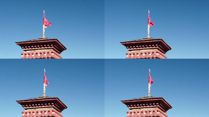 蓝天随风飘舞的红旗建筑旗帜红房子房檐房顶