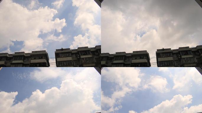 广州夏天上午蓝天白云低矮掠过楼顶飘向远方