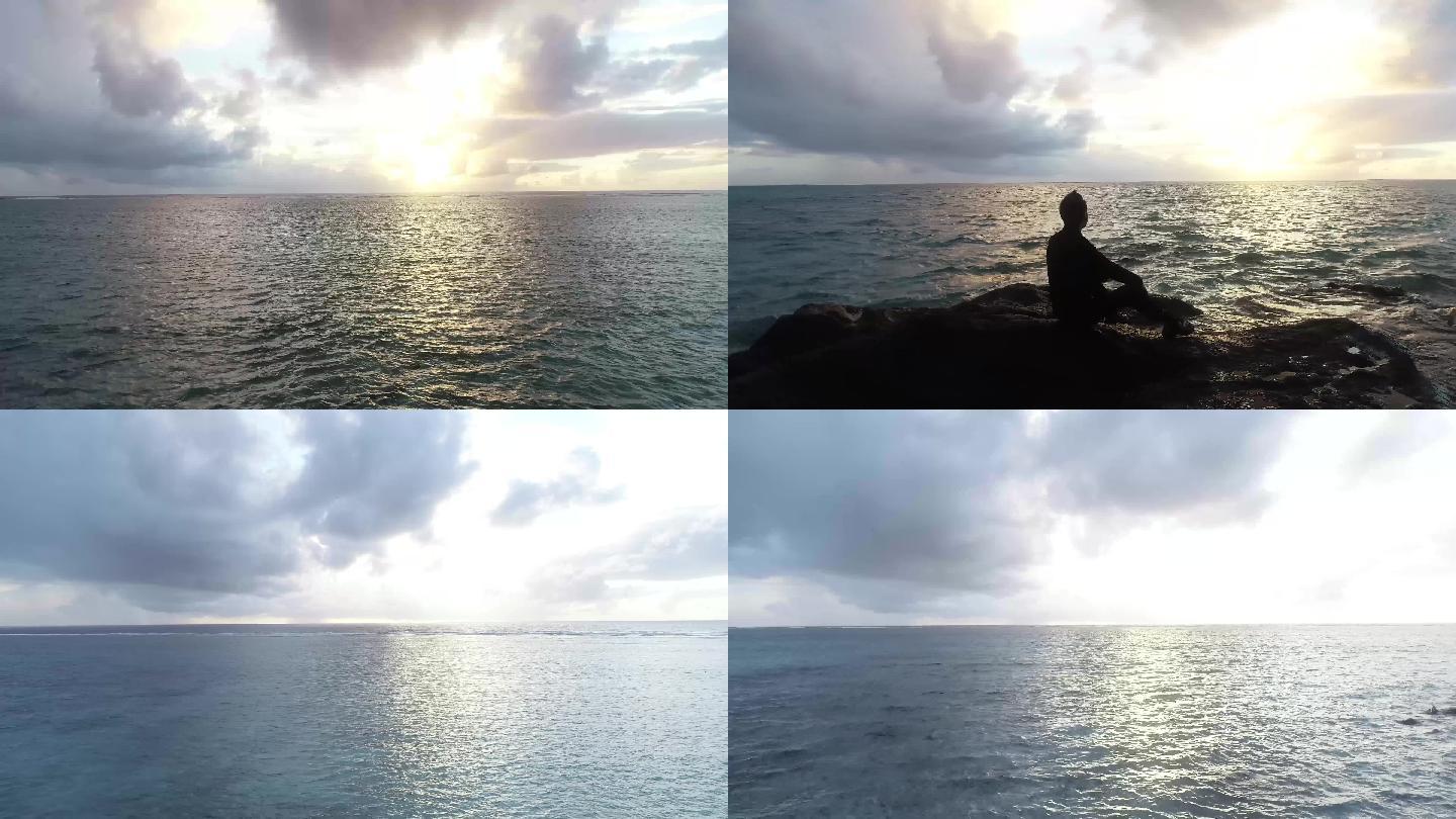 人坐在海边石头日出帕劳绝美海边