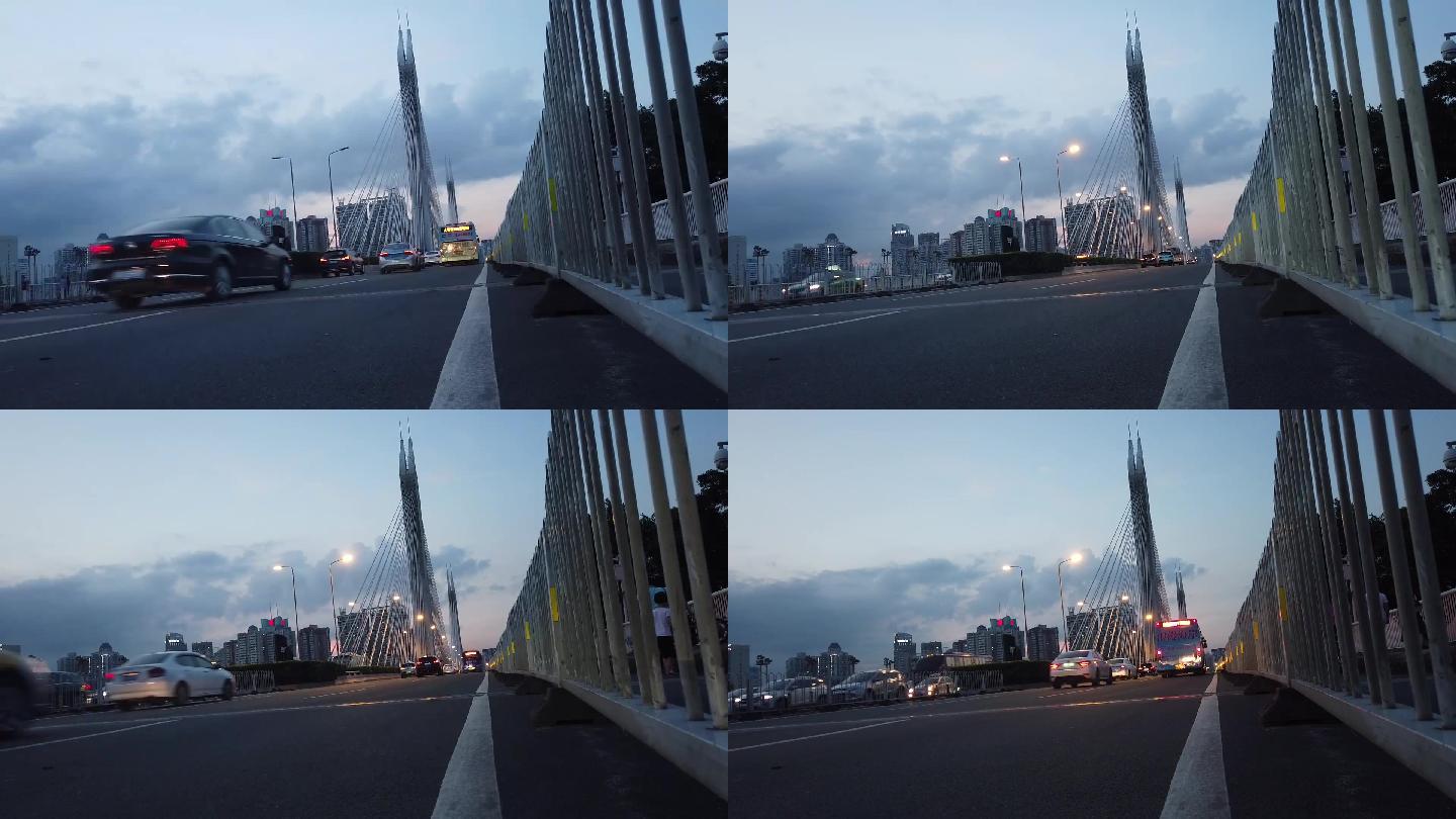 傍晚实拍夏天广州的海印大桥路灯亮起