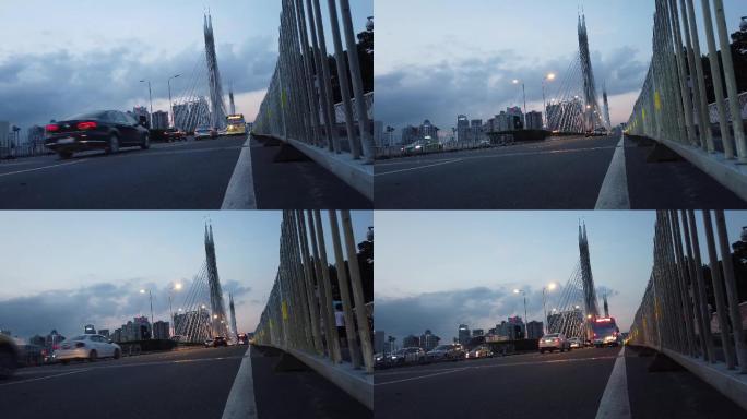 傍晚实拍夏天广州的海印大桥路灯亮起