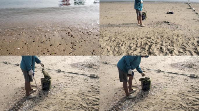 早晨环保清洁工人清洁海滩的垃圾