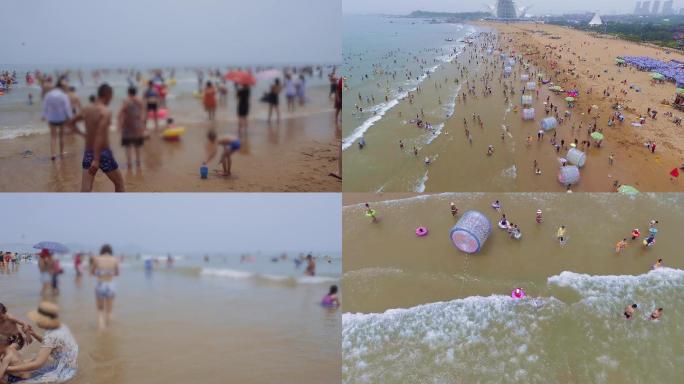 4K炎热夏天航拍海边洗海澡人群海水浴场