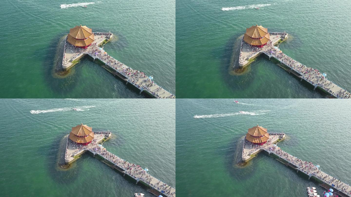 青岛海滨栈桥航拍海岸线渔船海滨旅行游客