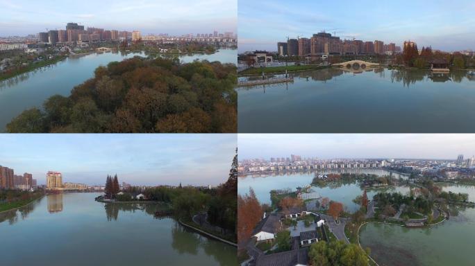 傍晚夕阳下现代化城市小区居民住宅湖面美景