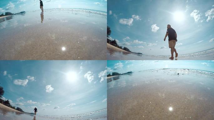 鱼眼镜头超广角拍摄一个人在海滩上散步