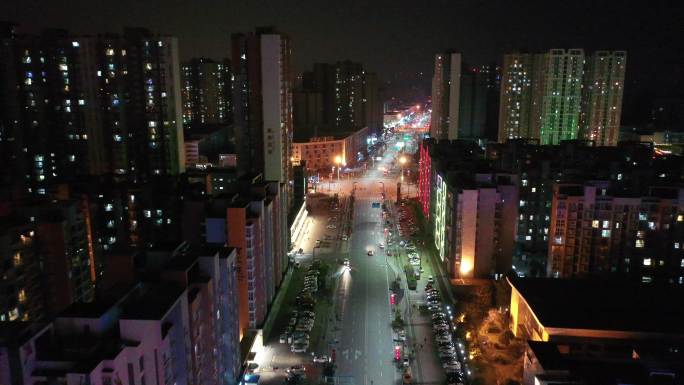 四川成都郫县城市道路夜景航拍高楼霓虹