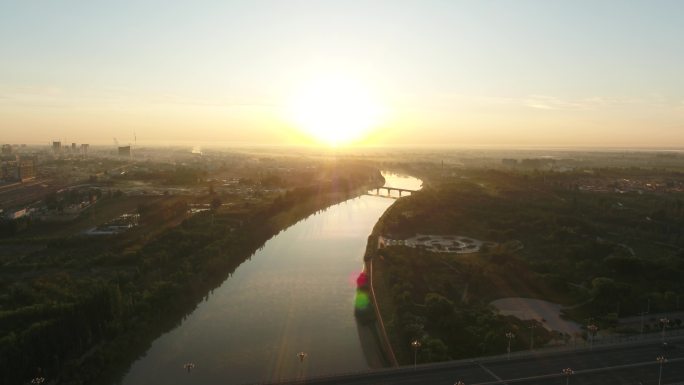 航拍内蒙古巴彦淖尔清晨黄河河道与城市4k