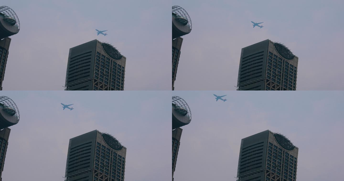 实拍飞机飞过高楼城市航空公司、可商用
