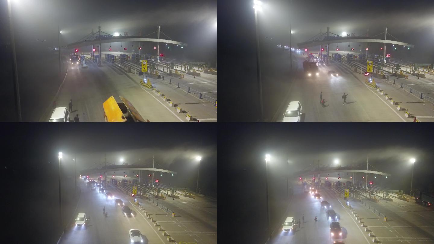 大雾夜晚车队过高速收费站航拍