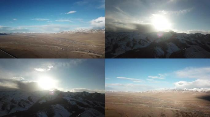 航拍唐古拉山北青藏线夕阳照射下的雪山草原