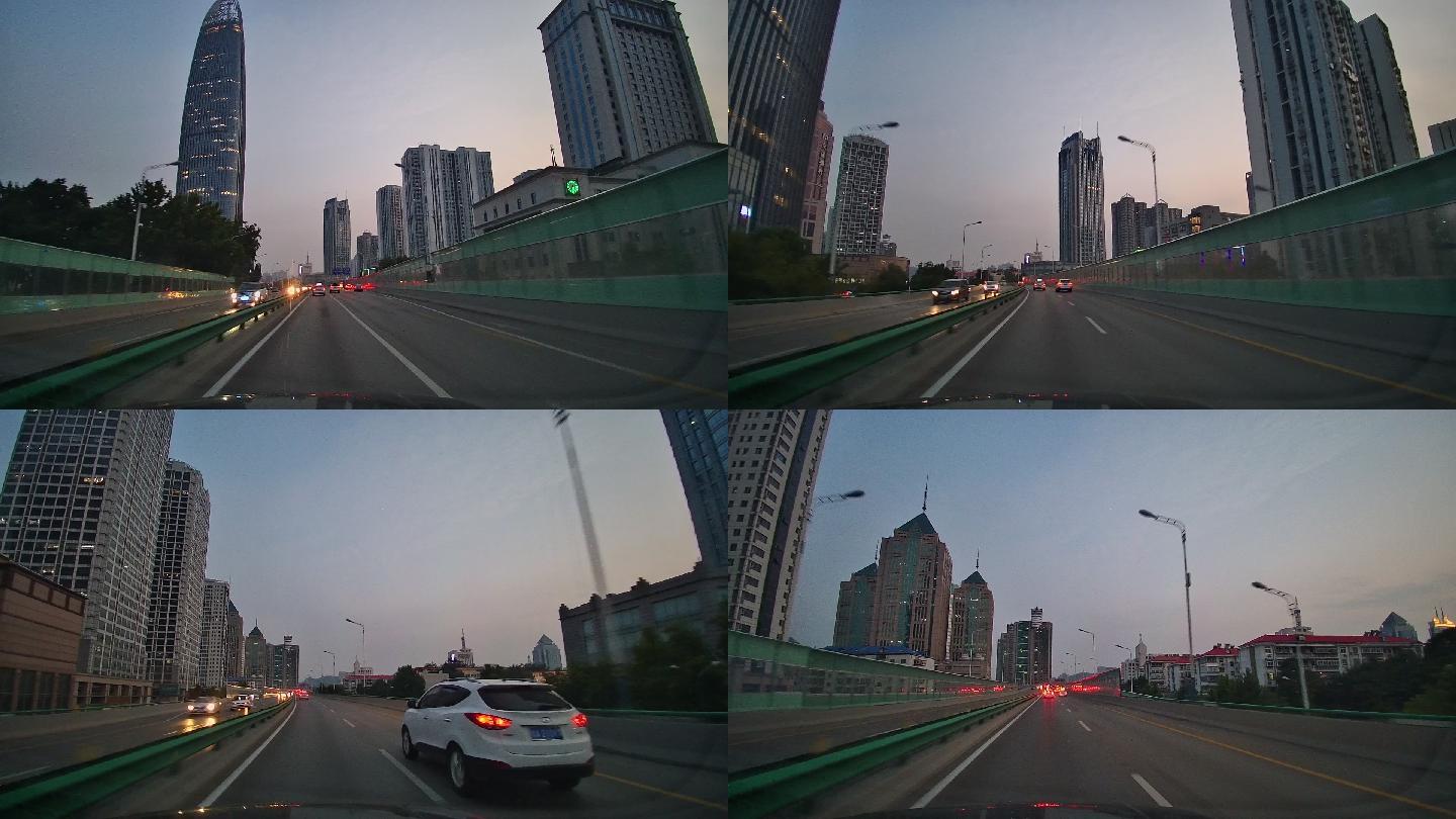快速公路行驶车辆日出太阳车内拍摄城市道路