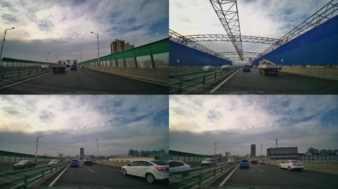 高速公路行驶车辆日出太阳车内拍摄城市道路