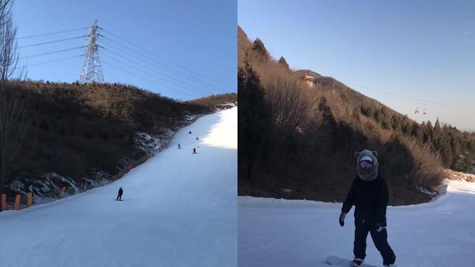 下高级道雪场单板滑行美女帅哥