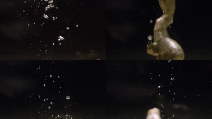 生姜掉入水中慢镜头